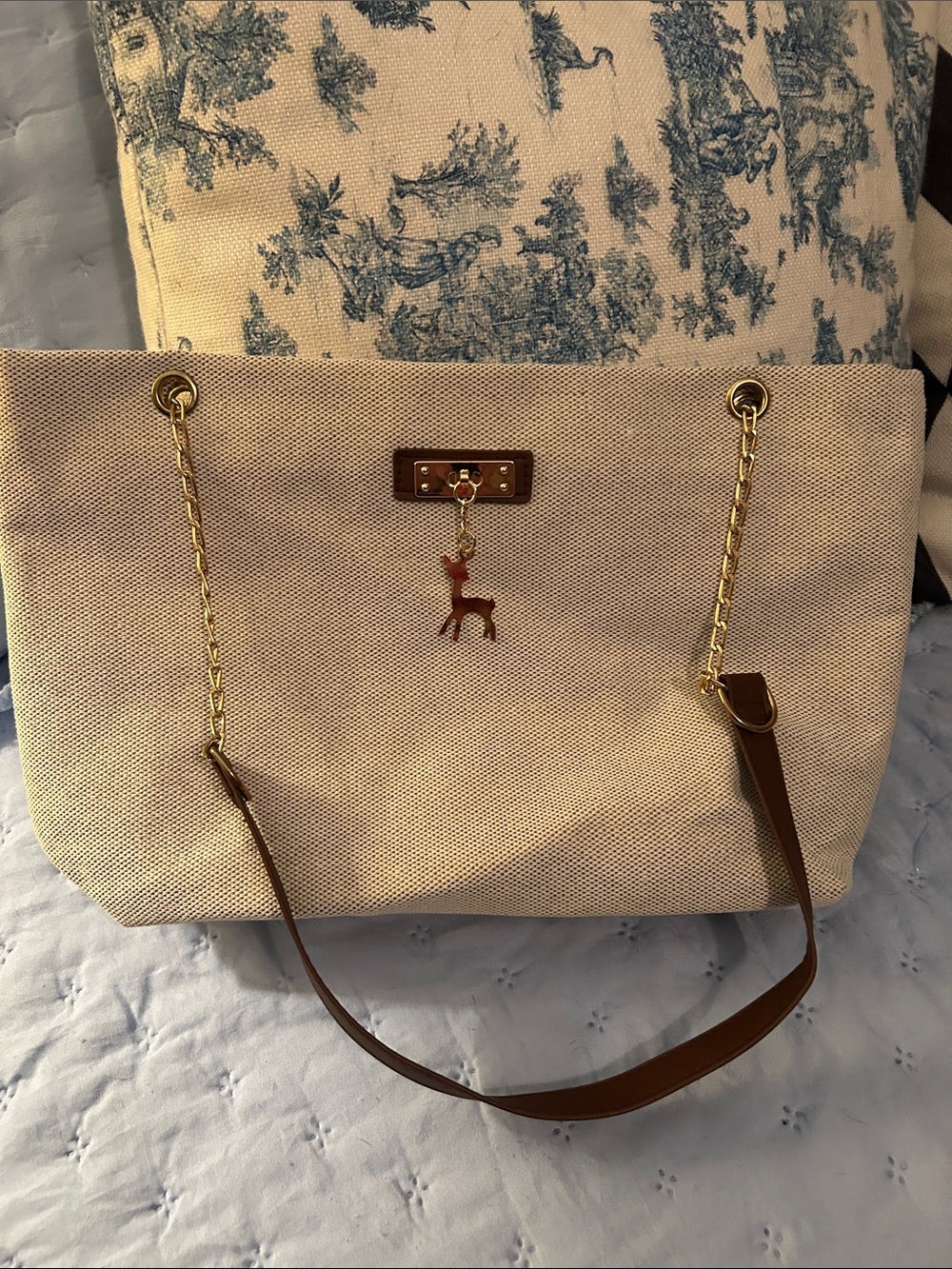 Beige Canvas Tote Bag with Brown Leather Trim and Gold Chain Accent